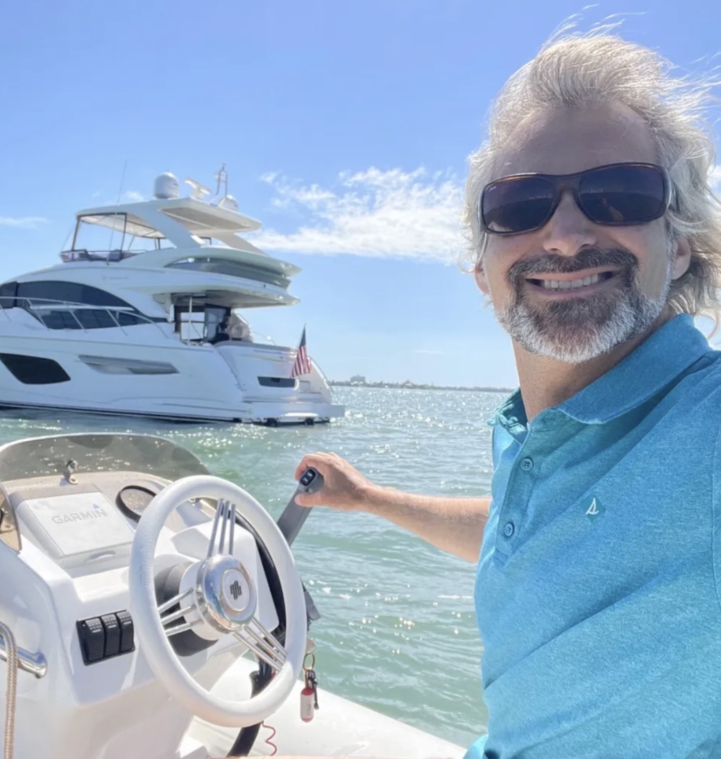 Capt. Zac Oppenheim on a boat near the St. Petersburg waterfront