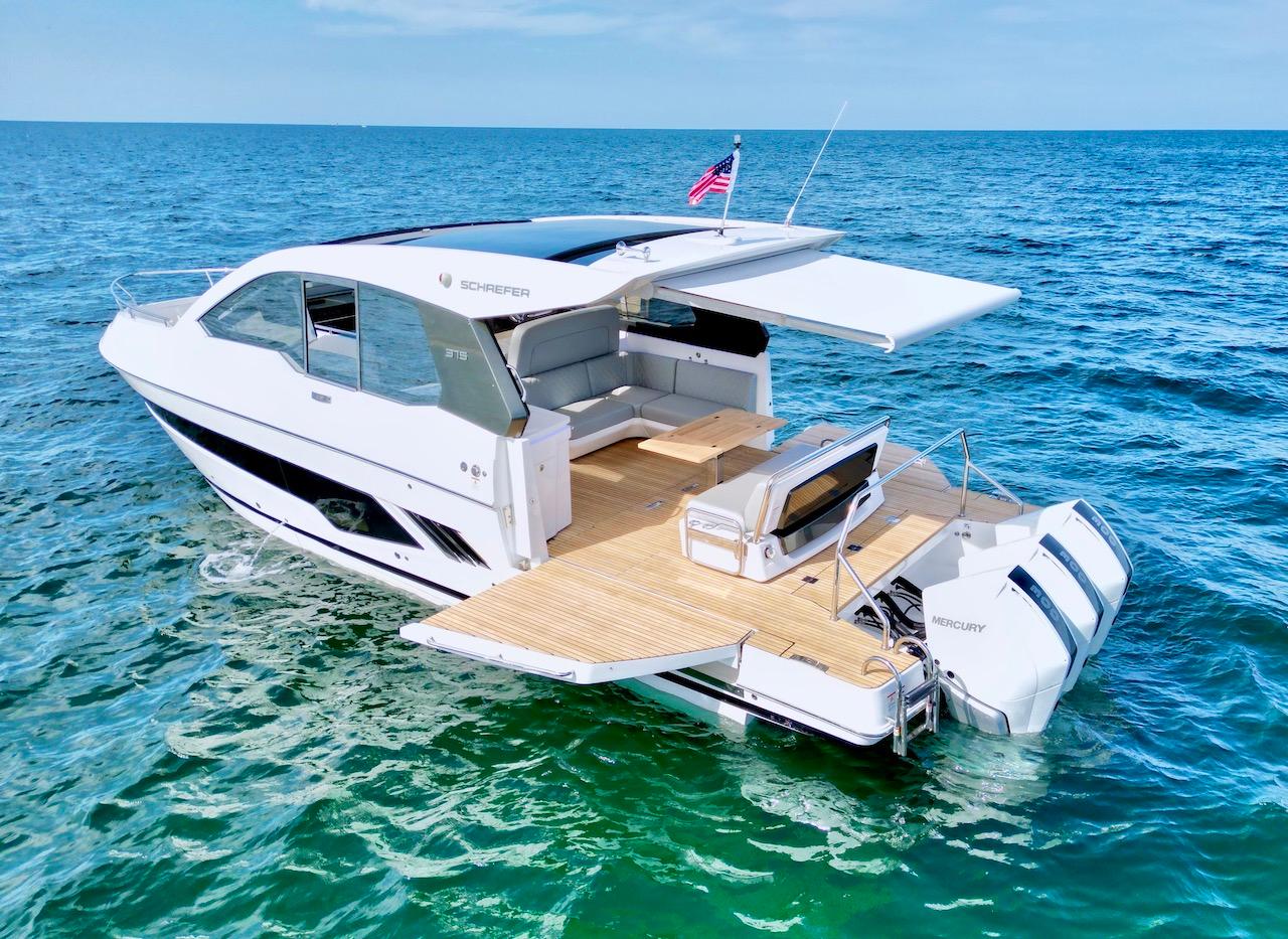 Schaefer 375 yacht-style dayboat anchored in clear Gulf Coast water